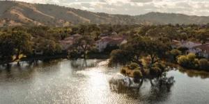 Aerial view of Rancho Santa Margarita with Lago Santa Margarita in the foreground and Saddleback foothills in the background