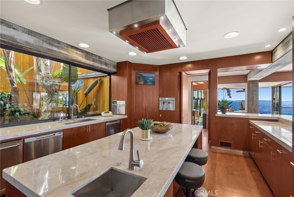 Kitchen island with stone counters at 100 Rockledge Road, Laguna Beach Kitchen island with stone counters at 100 Rockledge Road, Laguna Beach