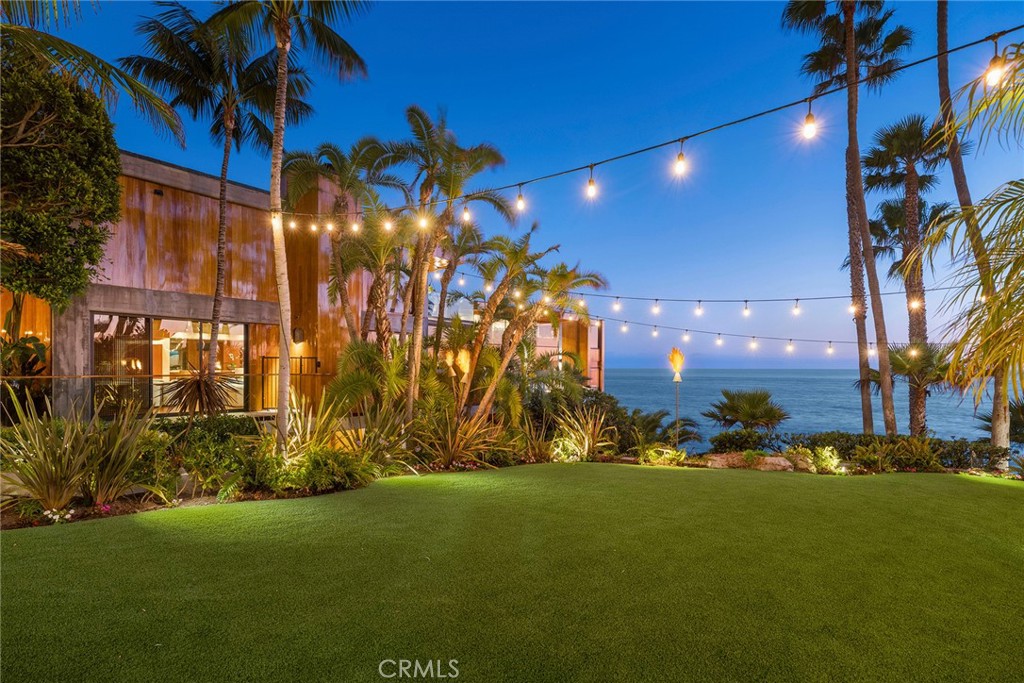 Lawn at twilight under string lights at 100 Rockledge Road, Laguna Beach Lawn at twilight under string lights at 100 Rockledge Road, Laguna Beach