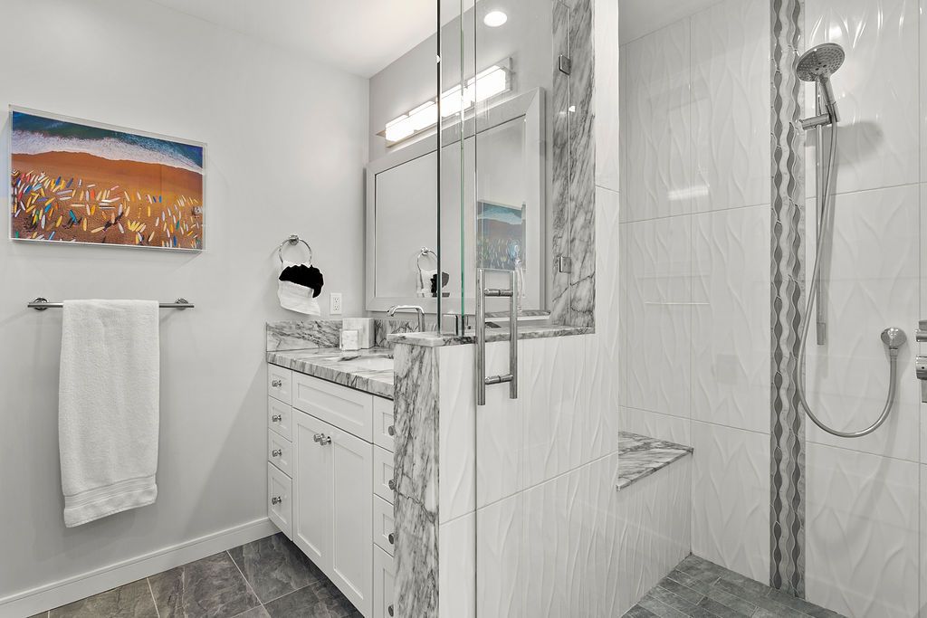 Marble bathroom with walk-in shower at 166 Fairview St, Laguna Beach Marble bathroom with walk-in shower at 166 Fairview St, Laguna Beach