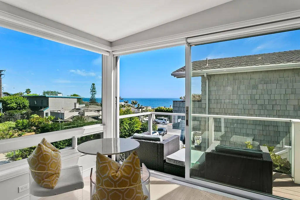 Corner windows framing the ocean at 166 Fairview St, Laguna Beach Corner windows framing the ocean at 166 Fairview St, Laguna Beach