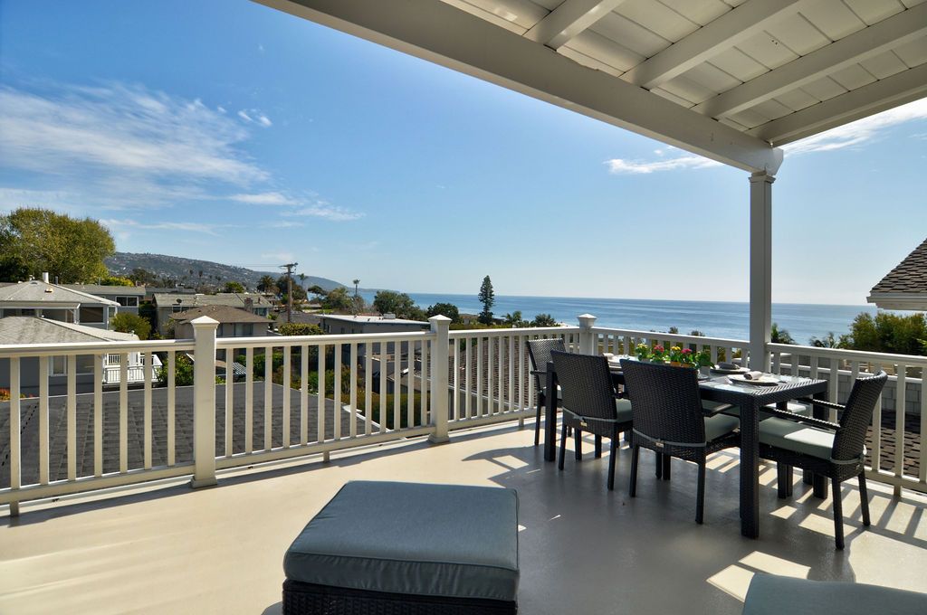Covered ocean-view deck with outdoor dining at 166 Fairview St, Laguna Beach Covered ocean-view deck with outdoor dining at 166 Fairview St, Laguna Beach