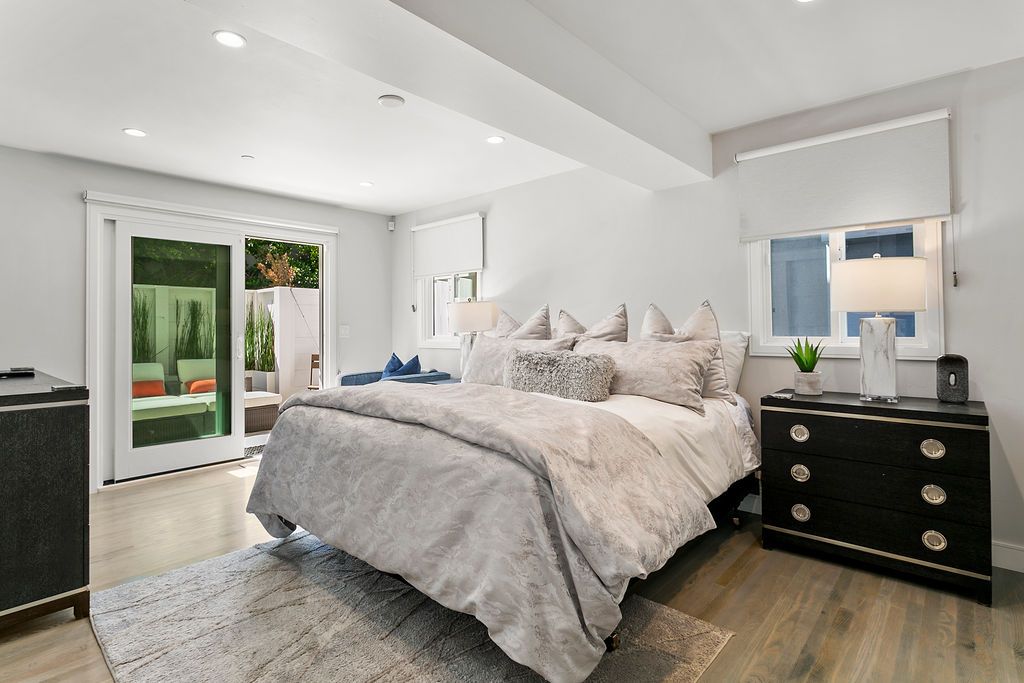Primary bedroom opening to the garden retreat at 166 Fairview St, Laguna Beach Primary bedroom opening to the garden retreat at 166 Fairview St, Laguna Beach