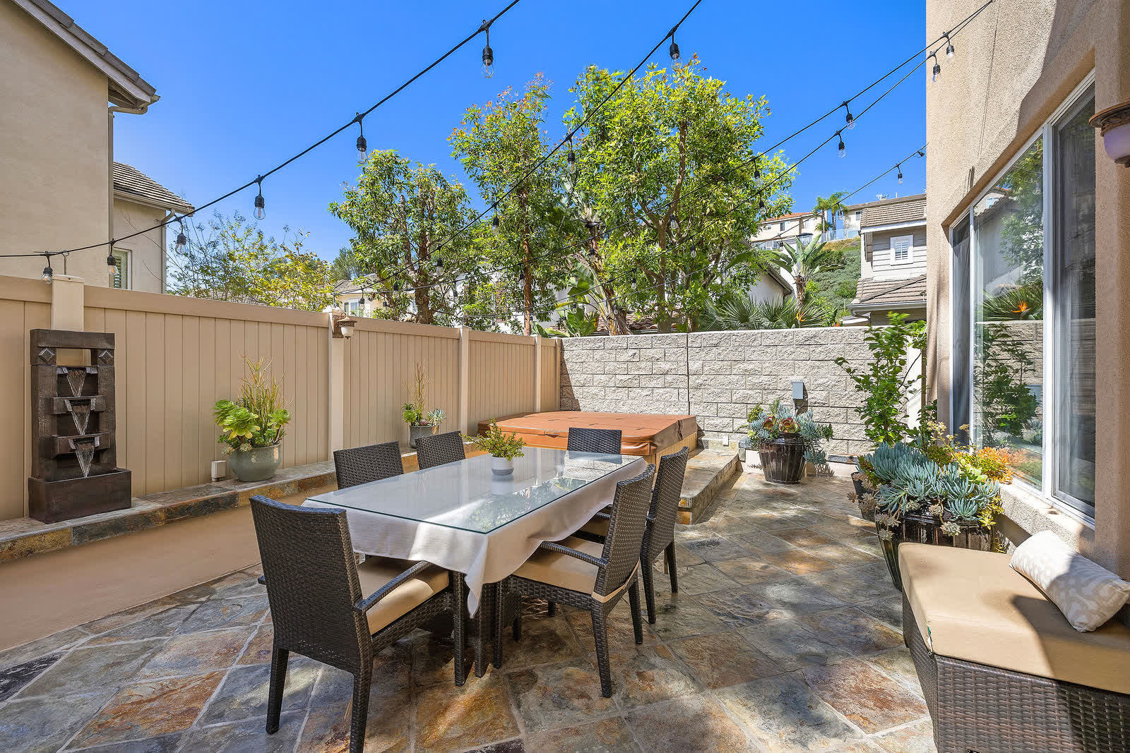Backyard dining table on the flagstone patio at 5 Lyon Ridge, Aliso Viejo