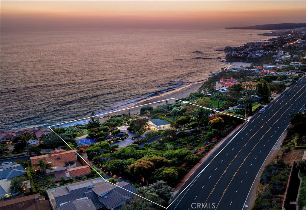 Twilight aerial with the parcel boundary outlined along Coast Highway above the beach at 32229 Coast Hwy, Laguna Beach Twilight aerial with the parcel boundary outlined along Coast Highway above the beach at 32229 Coast Hwy, Laguna Beach