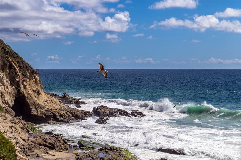 Waves breaking along the rocky shoreline at 32229 Coast Hwy, Laguna Beach Waves breaking along the rocky shoreline at 32229 Coast Hwy, Laguna Beach