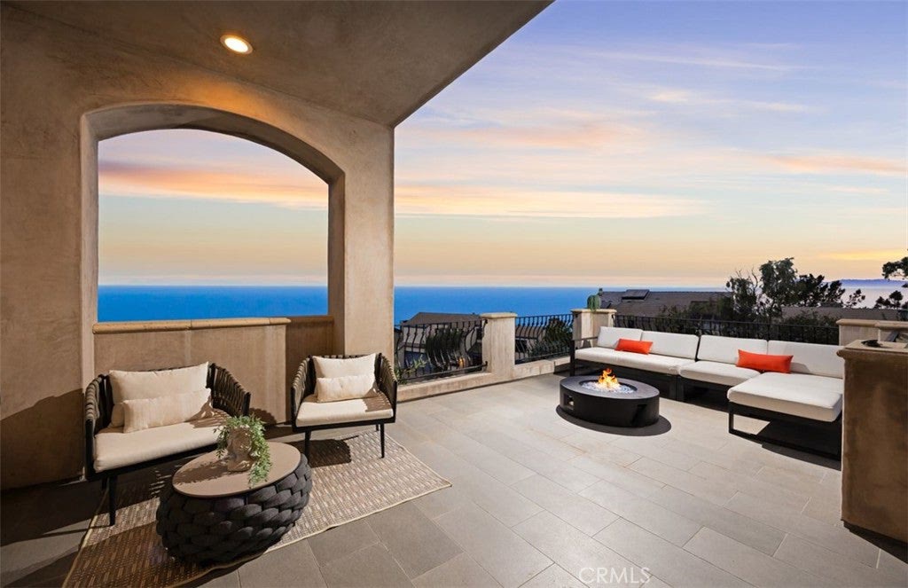 Covered terrace with fire pit above the ocean at 740 Bolsana Drive, Laguna Beach