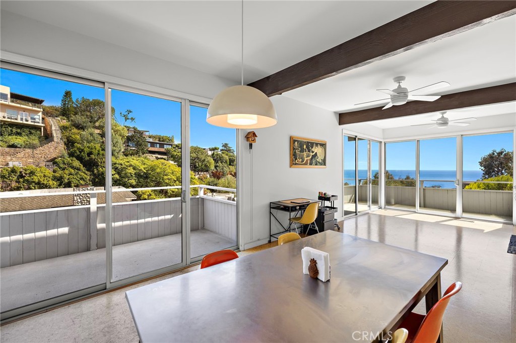 Dining area beside sliding doors to the deck at 888 Summit Drive, Laguna Beach